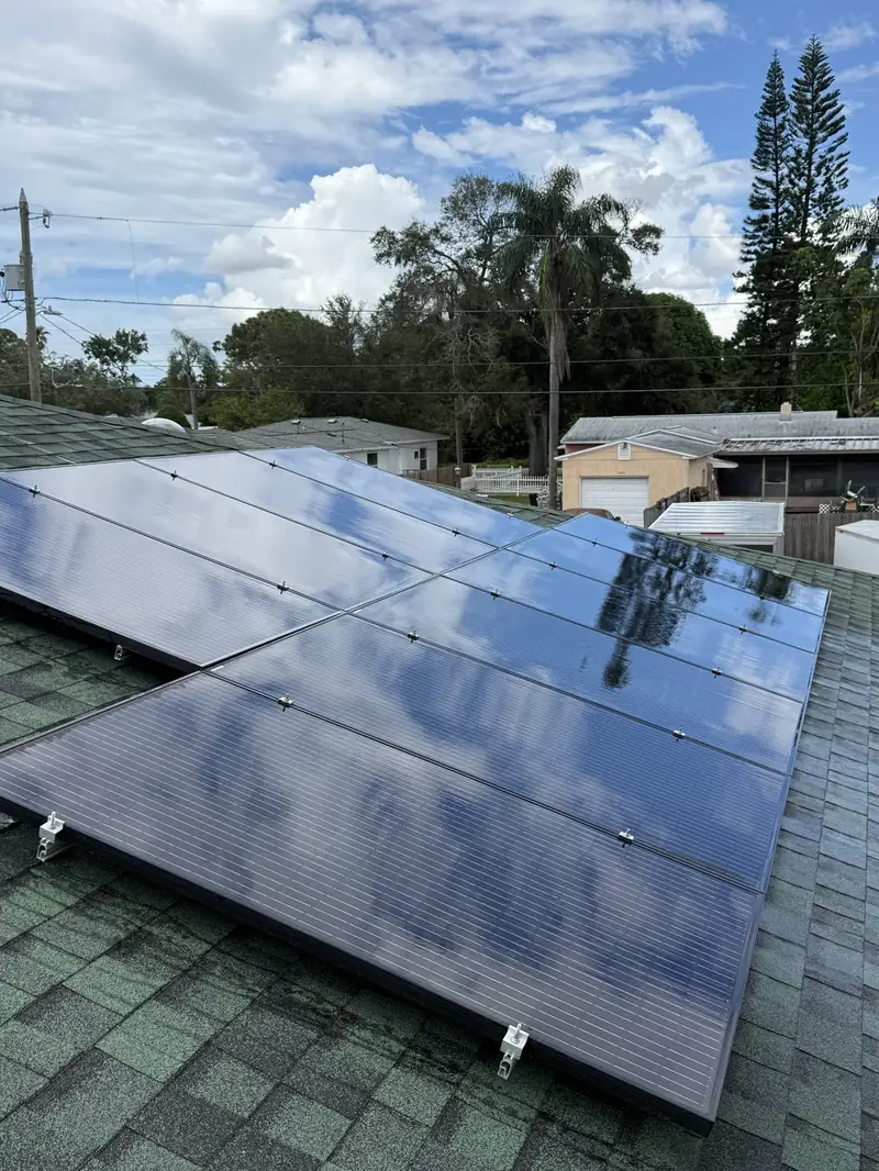 Clean solar panels on a waterfront home with a cupola roof